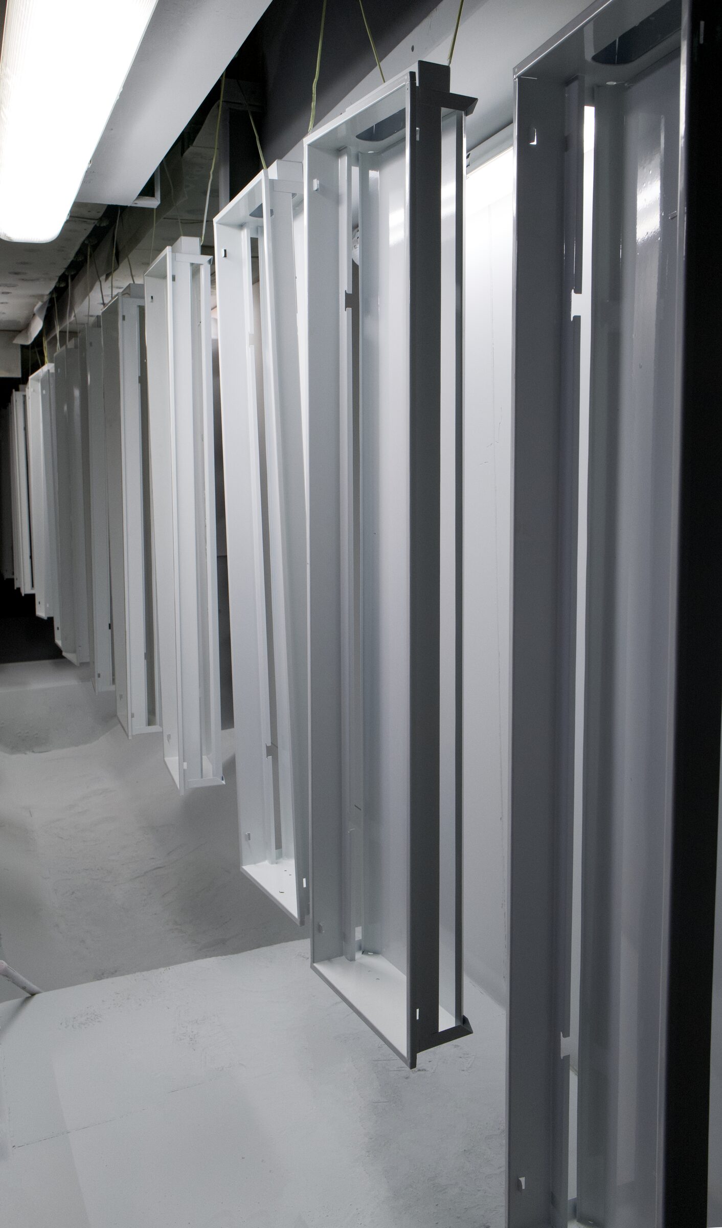 Lighting fixture housings on the Metosu paint line